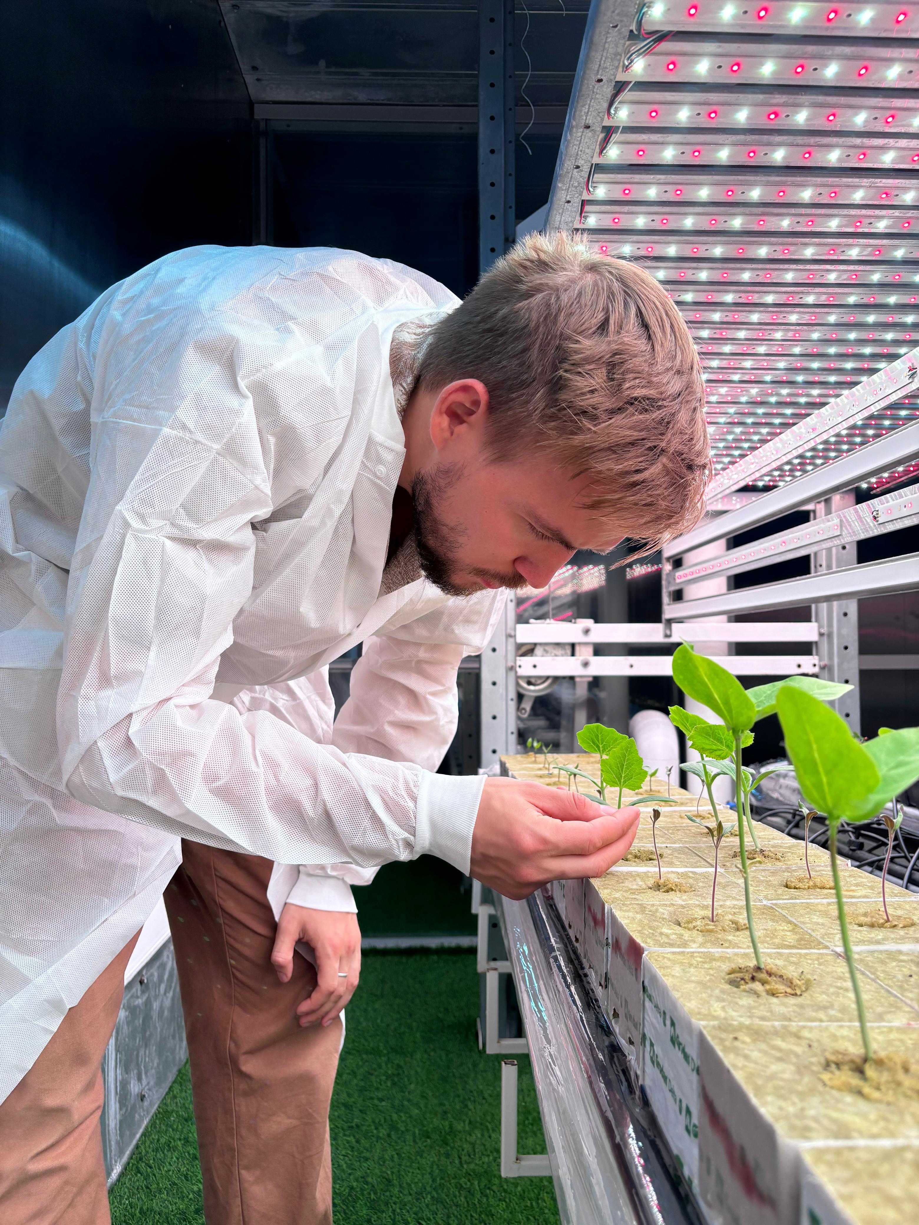 Ilia Sukhodolov reviewing vertical farm schematics